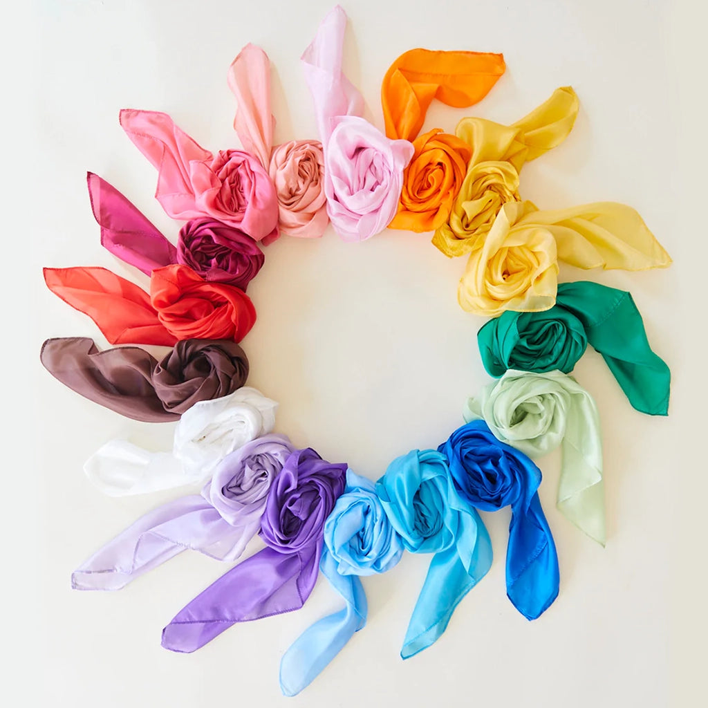 Flatlay of all color variations of Sarah's Silks Playsilks in a circular pattern.
