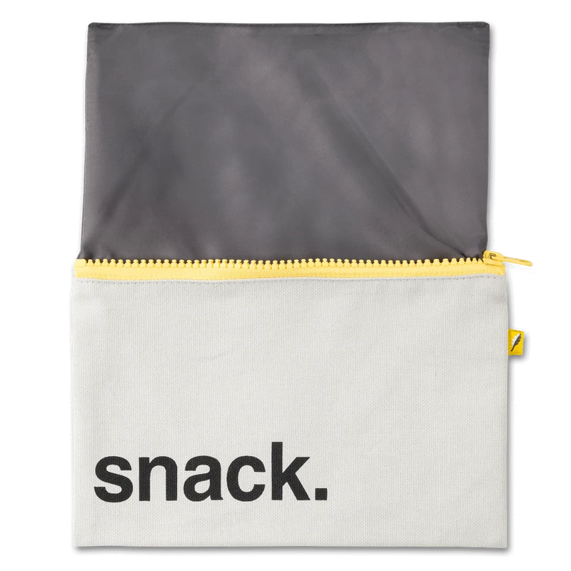 life_style2, Fluf Black Zippered Reusable Snack Sack Food Container white canvas, yellow zipper and tag, black font and interior