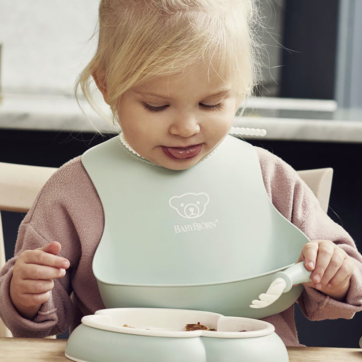 BabyBjorn Powder Green Soft Bib, Infant Feeding Accessory offering a secure and comfortable fit for your baby