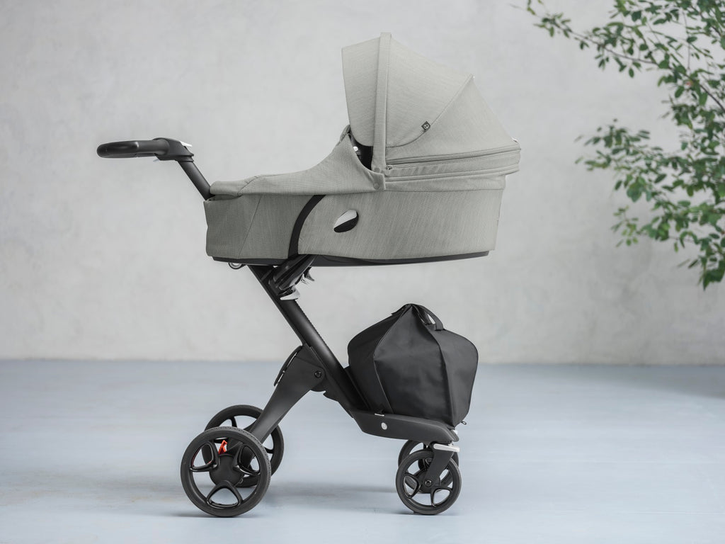 lifestyle_1, stokke xplory v6 secure flat protective carry cot hard shell height adjustable breathable exceptional ventilation extended canopy