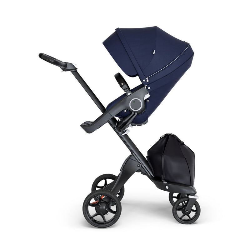 stokke xplory v6 ergonomic travel system stroller luxurious height adjustable front rear facing foldable chassis comfortable black frame black leatherette handle deep navy blue