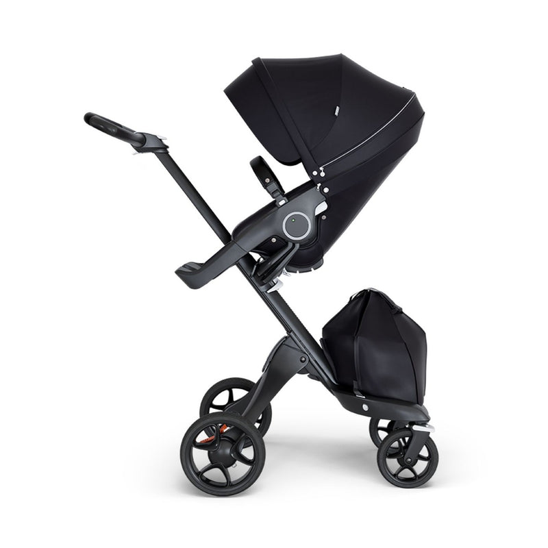 stokke xplory v6 ergonomic travel system stroller luxurious height adjustable front rear facing foldable chassis comfortable black frame black leatherette handle solid black