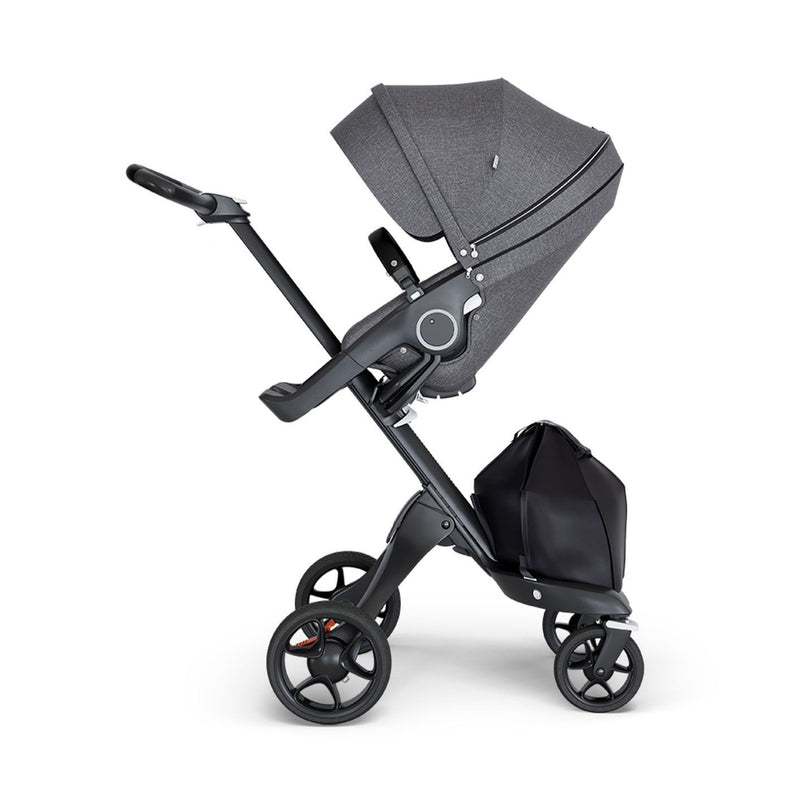 stokke xplory v6 ergonomic travel system stroller luxurious height adjustable front rear facing foldable chassis comfortable black frame black leatherette handle black melange