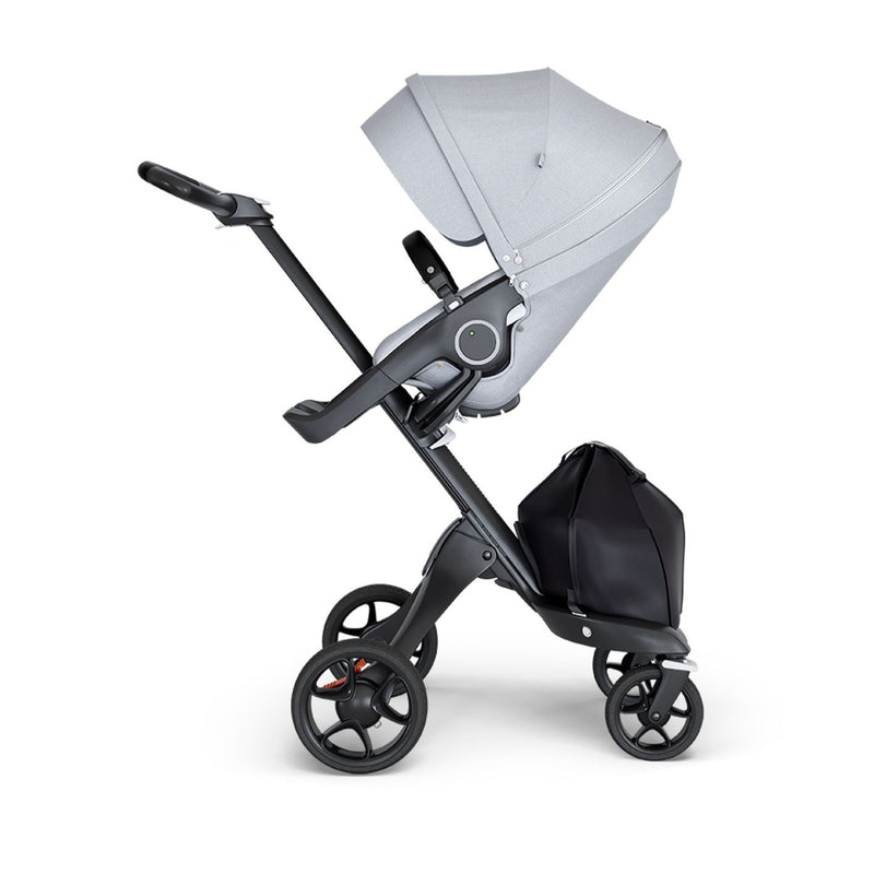 stokke xplory v6 ergonomic travel system stroller luxurious height adjustable front rear facing foldable chassis comfortable black frame black leatherette handle grey melange