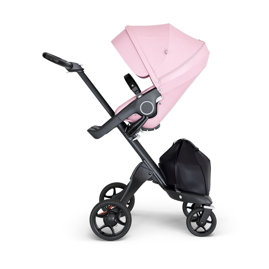 stokke xplory v6 ergonomic travel system stroller luxurious height adjustable front rear facing foldable chassis comfortable black frame black leatherette handle light lotus pink