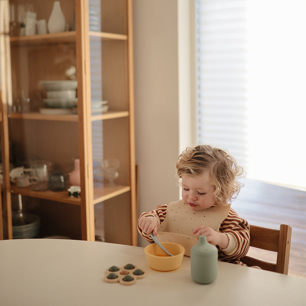 Mushie Silicone Suction Bowl in Daffodil an eye-catching color and design that helps your baby enjoy their meals with less mess