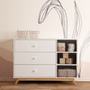 dadada White/Natural Central Park 3-Drawer Dresser Children's Nursery. in nursery with decor and filled baskets. Babys furniture