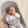 baby smiling in baby bjorn bouncer bliss sand grey cotton baby bouncer