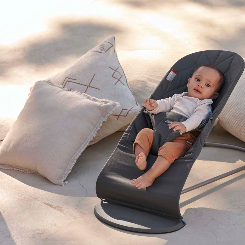 baby lounging outside in baby bjorn bouncer bliss anthracite petal quilt