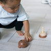 Wee Gallery Bear Wooden Stacker Children's Stacking Game. Lifestyle photo of child playing with Bear Stacker.