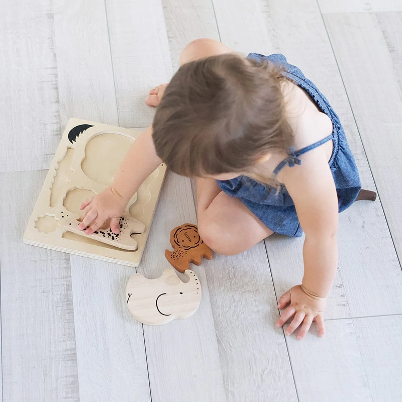 Wooden puzzle being used by wee gallery